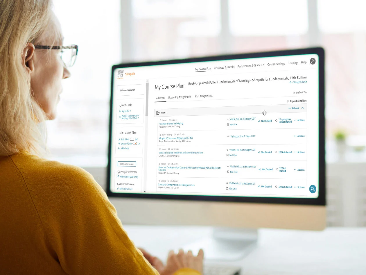 Female professor reviewing computer screen