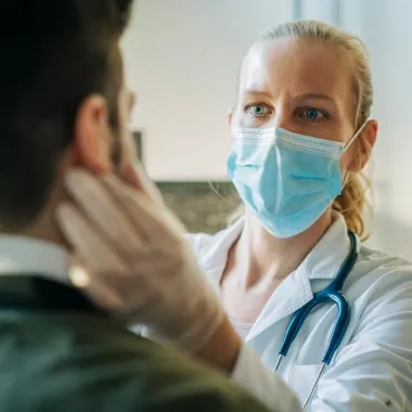 doctor examining patient