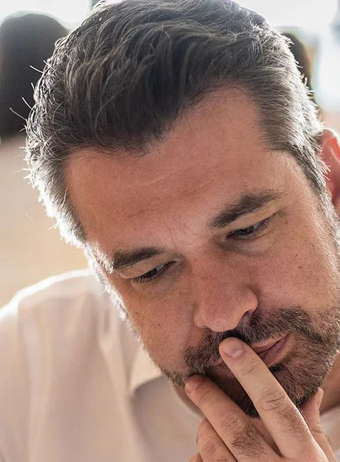 Man looking at digital tablet with colleague